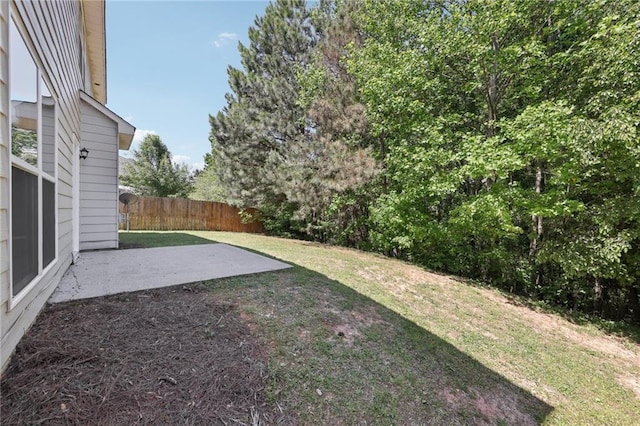 view of yard featuring fence and a patio area