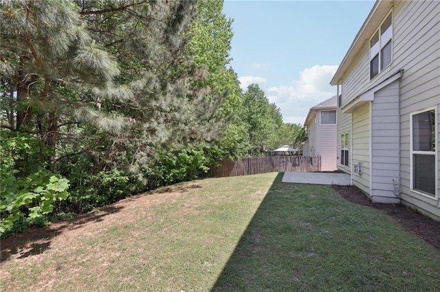view of yard with fence and a patio area