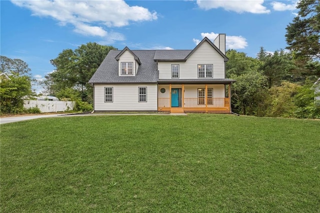 view of front of house with a porch, a chimney, a front yard, fence, and a shingled roof