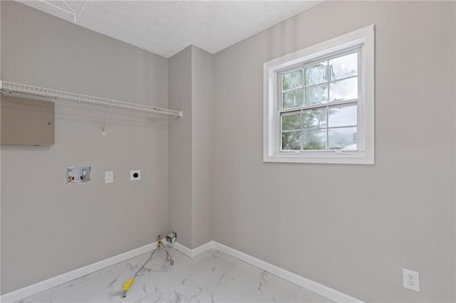 clothes washing area featuring laundry area, marble finish floor, baseboards, hookup for a washing machine, and hookup for an electric dryer