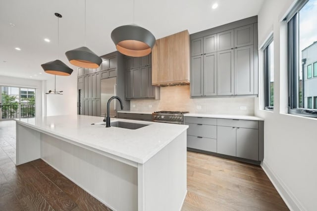 71 Krog St NE, Atlanta, GA 30307 - kitchen featuring a sink, gray cabinetry, backsplash, recessed lighting, and light wood-style floors