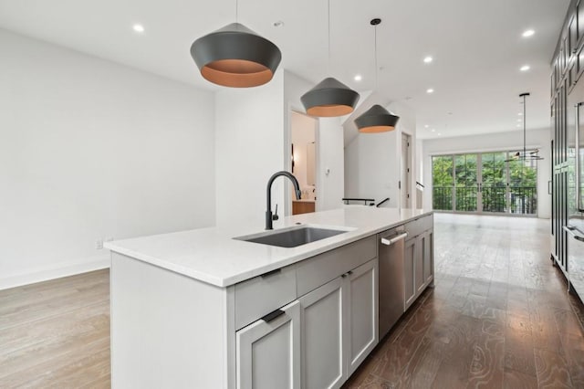 71 Krog St NE, Atlanta, GA 30307 - kitchen with a sink, dishwasher, an island with sink, wood finished floors, and open floor plan