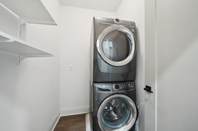 71 Krog St NE, Atlanta, GA 30307 - clothes washing area with estacked washer and dryer, baseboards, and dark wood-type flooring