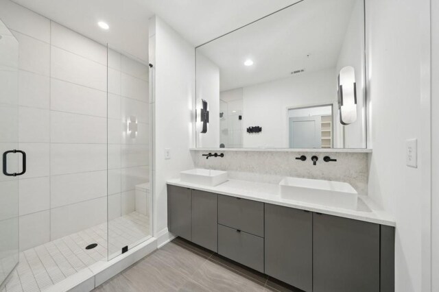 71 Krog St NE, Atlanta, GA 30307 - bathroom with a stall shower, double vanity, tile patterned floors, and recessed lighting