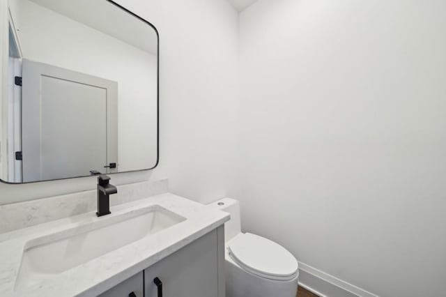 71 Krog St NE, Atlanta, GA 30307 - bathroom with toilet, vanity, and baseboards