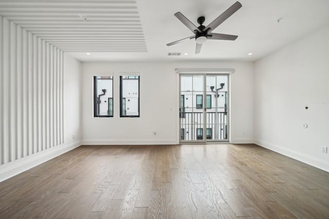 71 Krog St NE, Atlanta, GA 30307 - spare room with ceiling fan, wood finished floors, and baseboards