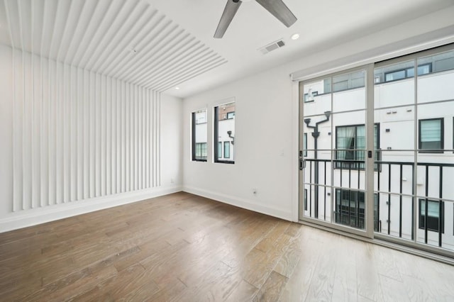 71 Krog St NE, Atlanta, GA 30307 - spare room with ceiling fan, wood finished floors, and baseboards