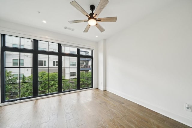 71 Krog St NE, Atlanta, GA 30307 - empty room with baseboards, wood finished floors, a ceiling fan, and recessed lighting