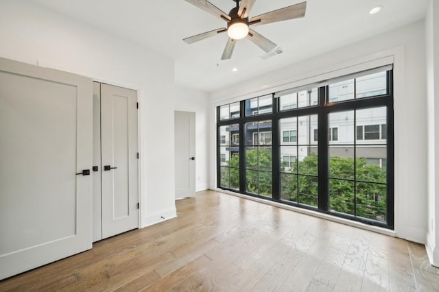 71 Krog St NE, Atlanta, GA 30307 - unfurnished bedroom featuring recessed lighting, baseboards, ceiling fan, and wood finished floors