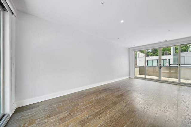 71 Krog St NE, Atlanta, GA 30307 - empty room featuring wood-type flooring, baseboards, french doors, and recessed lighting