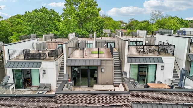 71 Krog St NE, Atlanta, GA 30307 - rear view of house with stairway, a standing seam roof, and metal roof