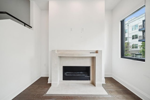 71 Krog St NE, Atlanta, GA 30307 - detailed view of wood finished floors, a fireplace with flush hearth, and baseboards
