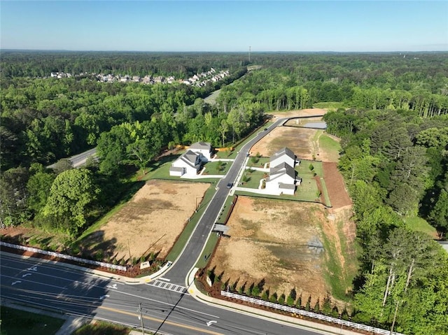 aerial overview of property's location with a forest