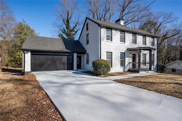 colonial home with a garage