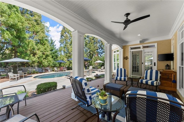 wooden terrace with outdoor lounge area, ceiling fan, fence, french doors, and a fenced in pool