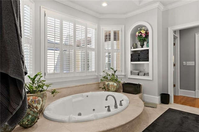 full bathroom featuring crown molding, baseboards, a tub with jets, and recessed lighting