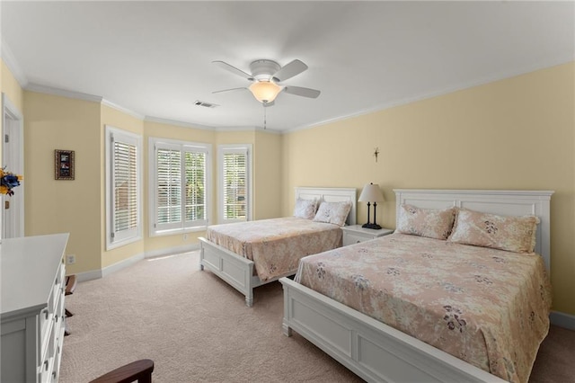 bedroom featuring baseboards, visible vents, light colored carpet, and crown molding