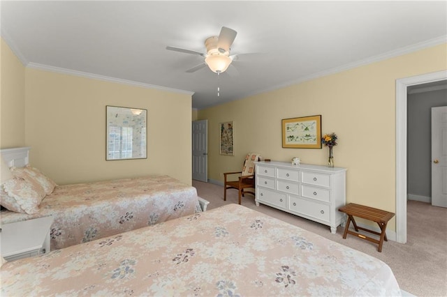 bedroom featuring ornamental molding, baseboards, and light carpet