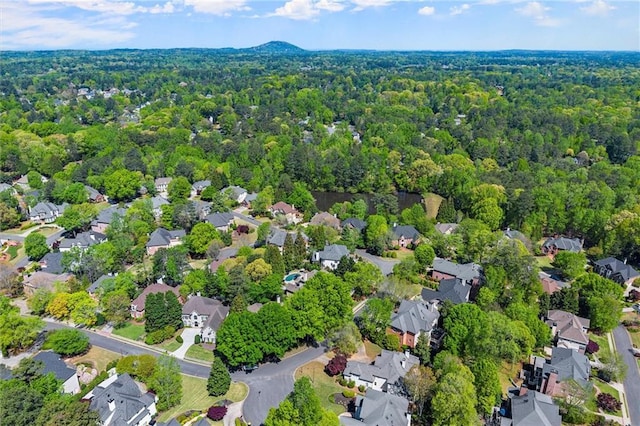 bird's eye view featuring a residential view and a forest view