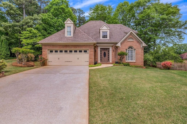 3171 Blairhill Ct, Atlanta, GA 30340 - view of front of house with a front yard, driveway, brick siding, an attached garage, and fence