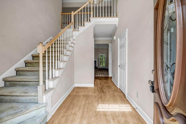 3171 Blairhill Ct, Atlanta, GA 30340 - foyer entrance featuring crown molding, stairway, wood finished floors, and baseboards