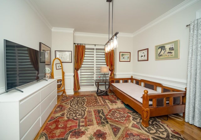 2521 Wood Creek Ct, Dacula, GA 30019 - bedroom featuring crown molding, wood finished floors, and wainscoting