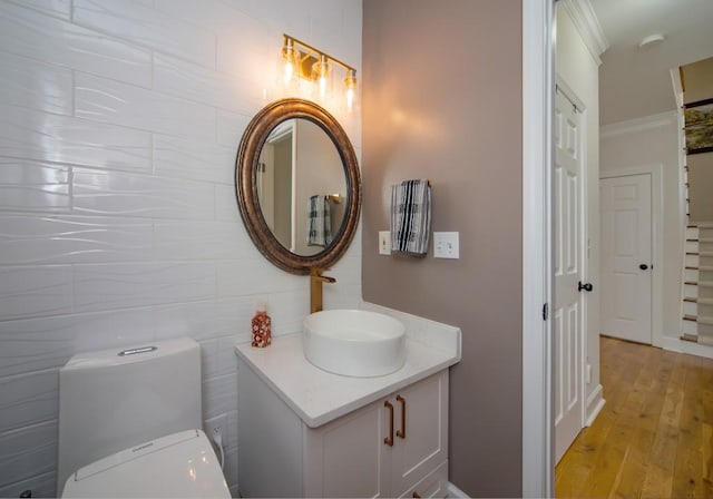 2521 Wood Creek Ct, Dacula, GA 30019 - bathroom with ornamental molding, vanity, and wood finished floors