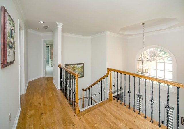 2521 Wood Creek Ct, Dacula, GA 30019 - hall featuring an upstairs landing, a chandelier, wood finished floors, recessed lighting, and a raised ceiling