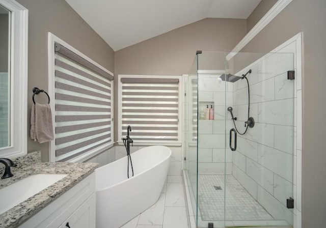 2521 Wood Creek Ct, Dacula, GA 30019 - full bath featuring marble look tiles, a freestanding bath, a stall shower, lofted ceiling, and vanity