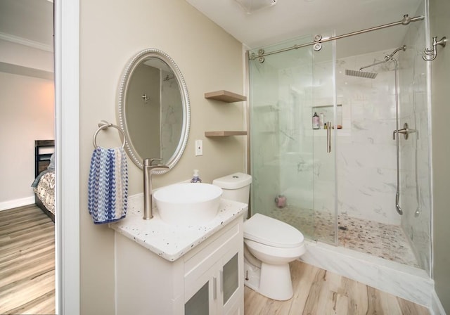 2521 Wood Creek Ct, Dacula, GA 30019 - ensuite bathroom featuring a shower stall, wood finished floors, and vanity