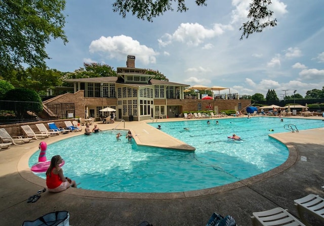 2521 Wood Creek Ct, Dacula, GA 30019 - community pool with a patio area