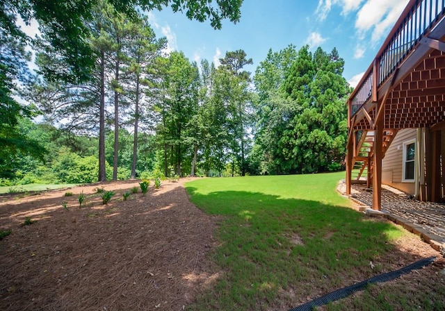 2521 Wood Creek Ct, Dacula, GA 30019 - view of green lawn featuring stairs and a wooden deck