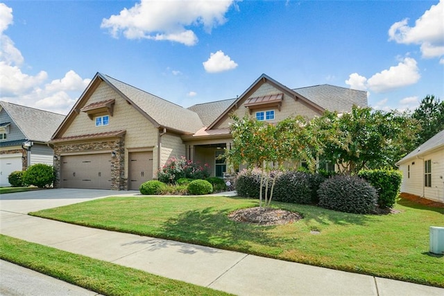 craftsman inspired home with a front yard and a garage