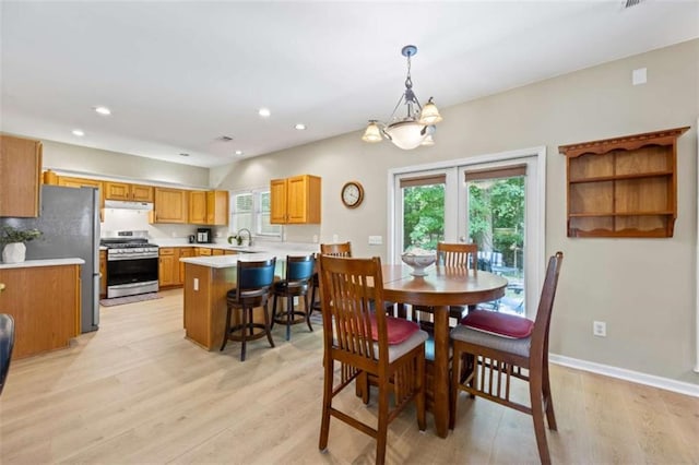 3652 Morning Creek Ct, Suwanee, GA 30024 - dining space with light wood-style floors, baseboards, recessed lighting, a chandelier, and french doors