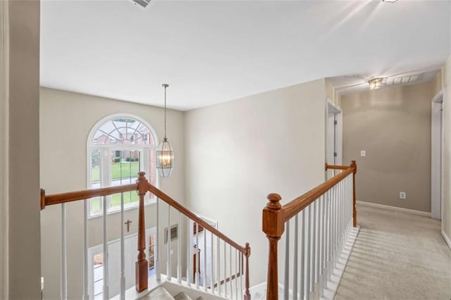 3652 Morning Creek Ct, Suwanee, GA 30024 - hallway with an upstairs landing, carpet flooring, a chandelier, and baseboards