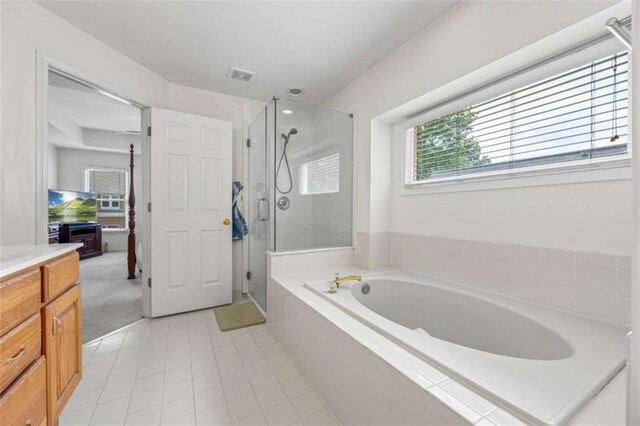 3652 Morning Creek Ct, Suwanee, GA 30024 - bathroom featuring a stall shower, a bath, tile patterned flooring, and vanity