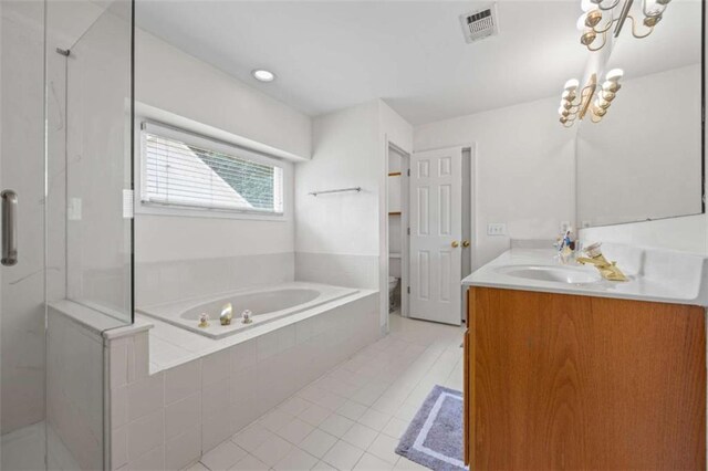 3652 Morning Creek Ct, Suwanee, GA 30024 - bathroom with tile patterned floors, a garden tub, vanity, and a shower stall