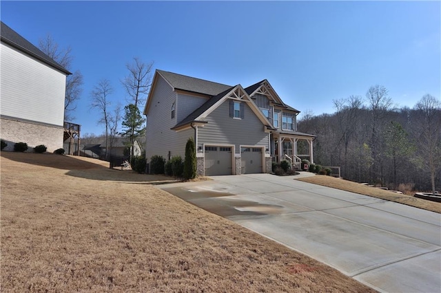 view of home's exterior with a garage and a yard