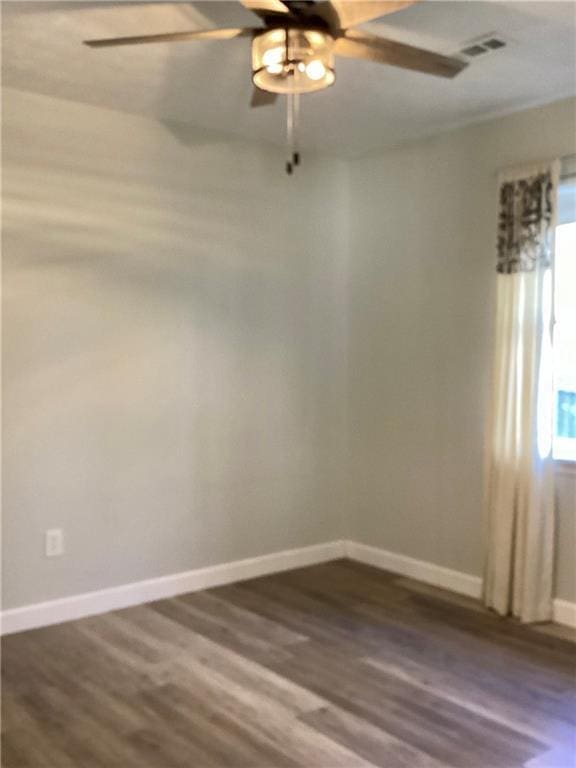 5085 Truman Mountain Rd, Gainesville, GA 30506 - empty room featuring a ceiling fan, baseboards, dark wood-style flooring, and plenty of natural light