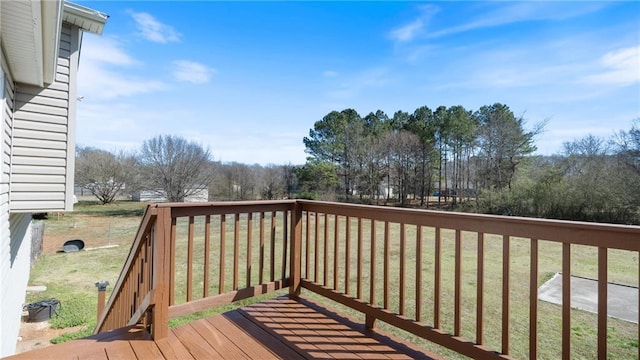 wooden deck with a yard