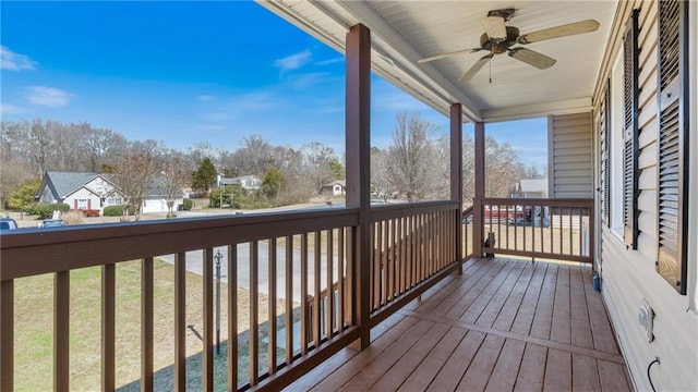 wooden terrace featuring ceiling fan