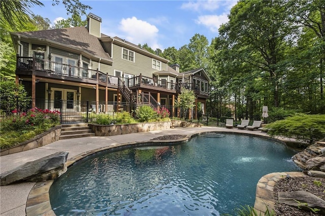 2160 Bradley Trl, Cumming, GA 30041 - back of house with french doors, an outdoor pool, a chimney, stairs, and a patio area