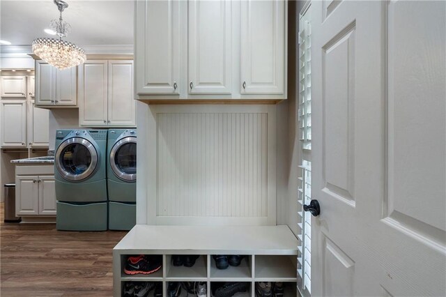 2160 Bradley Trl, Cumming, GA 30041 - clothes washing area with washer and dryer, cabinet space, a chandelier, and dark wood-style flooring