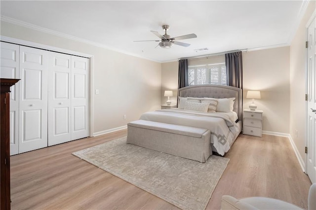 2160 Bradley Trl, Cumming, GA 30041 - bedroom with light wood finished floors, baseboards, crown molding, a closet, and a ceiling fan