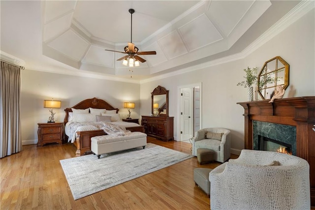 2160 Bradley Trl, Cumming, GA 30041 - bedroom featuring coffered ceiling, a premium fireplace, ornamental molding, light wood finished floors, and baseboards