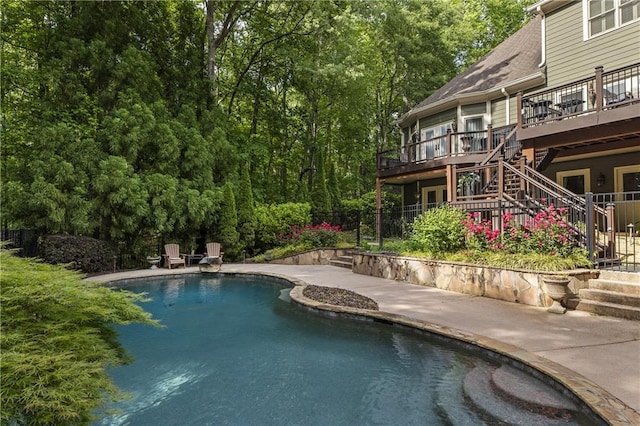 2160 Bradley Trl, Cumming, GA 30041 - outdoor pool with stairway, a wooden deck, a patio area, and fence