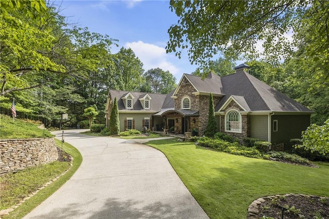 2160 Bradley Trl, Cumming, GA 30041 - view of front facade featuring stone siding and a front yard