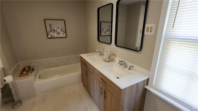 bathroom featuring a bath and vanity