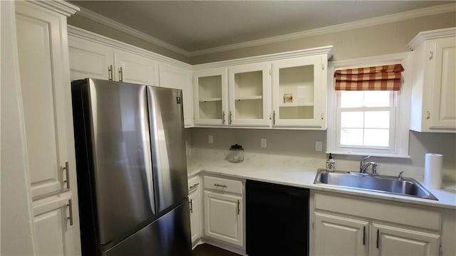 kitchen with dishwasher, white cabinetry, sink, and stainless steel refrigerator