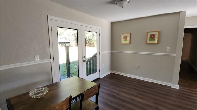 doorway featuring dark hardwood / wood-style flooring and french doors